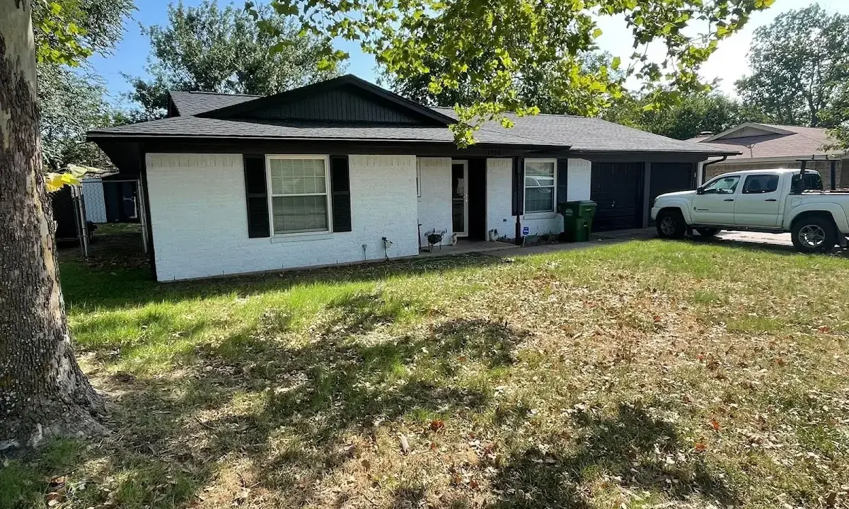 Professional roofing crew working on a residential roof in Trenton